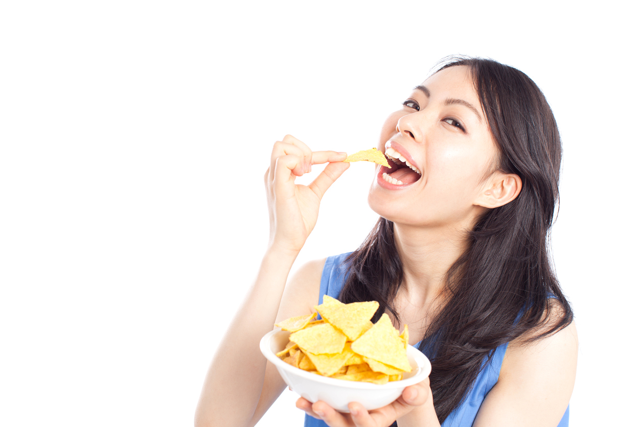 woman eating doritos
