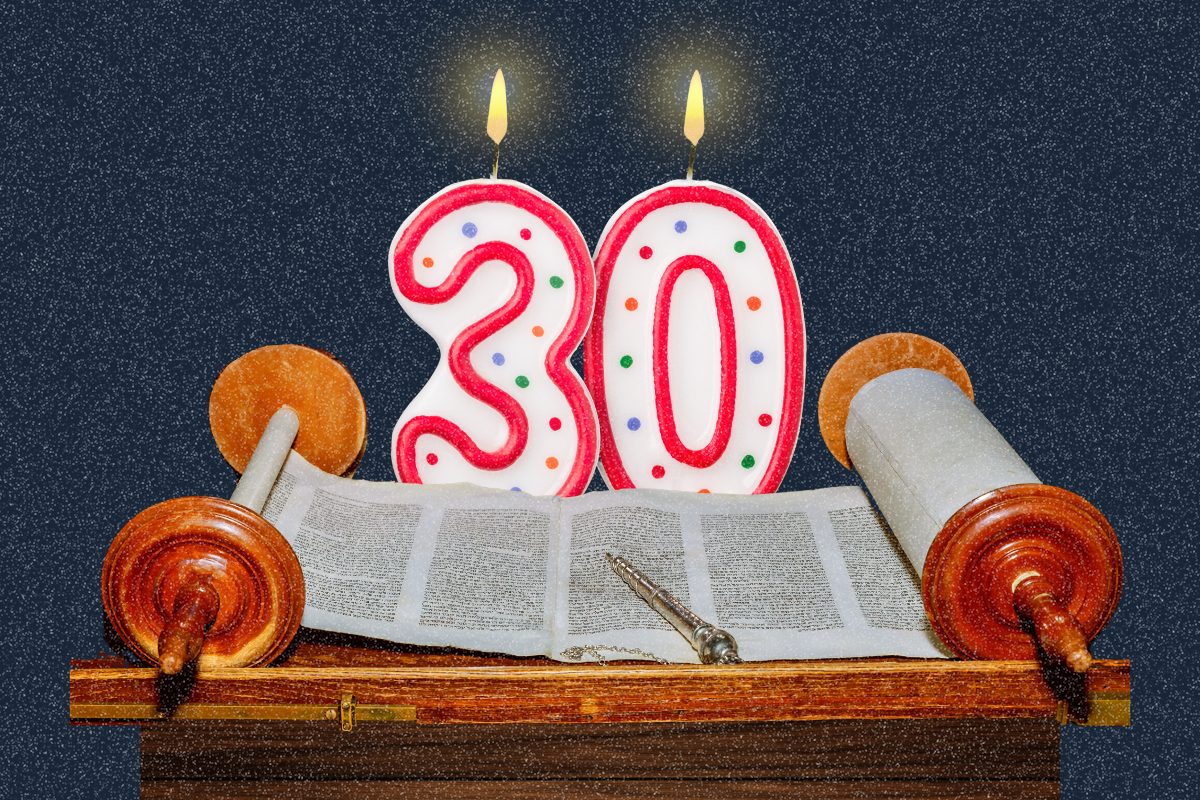 30th birthday candles behind a Torah scroll on a navy blue background