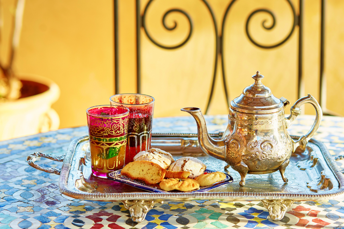 a Moroccan tea set laid out beautifully on a colorful table