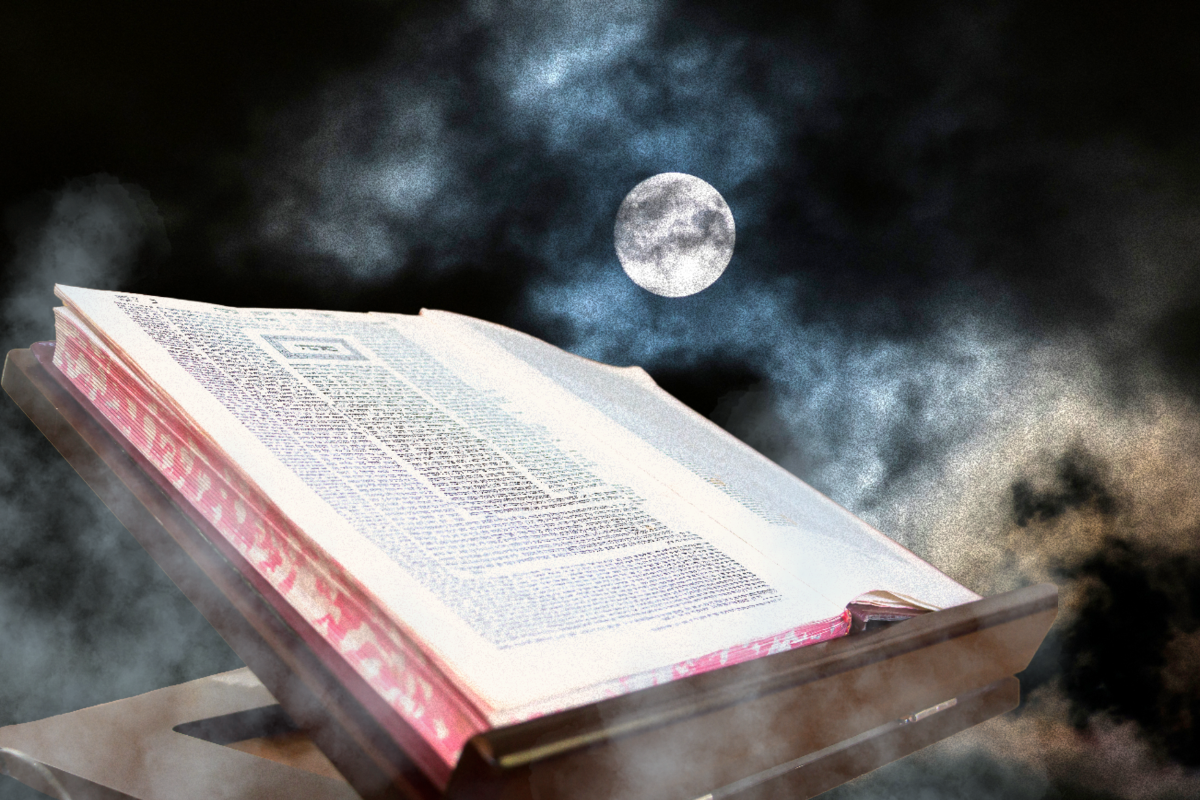 A book on a night background with a moon and fog