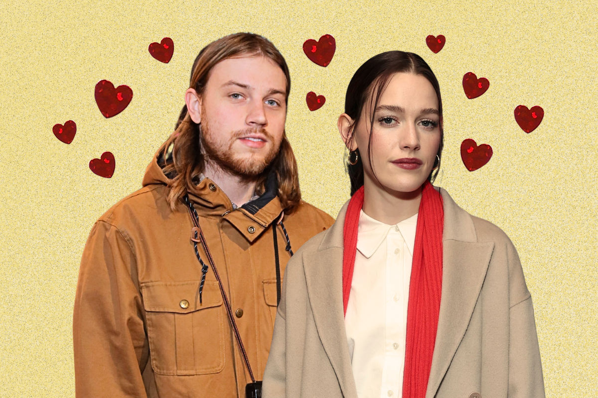 Ethan DeLorenzo and Victoria Pedretti appear beside one another against a yellow background and surrounded by red hearts.