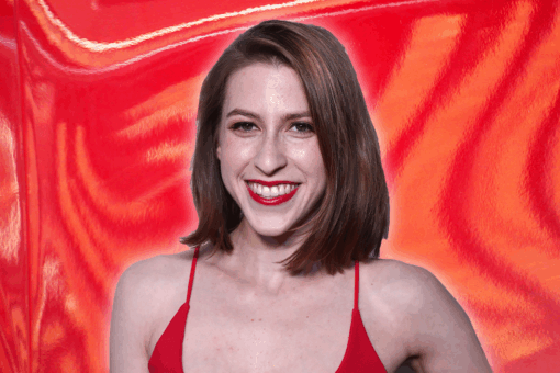 Eden Sher in a red dress and lipstick on an orange-red background.